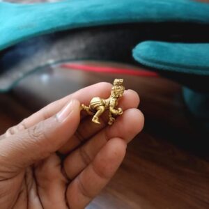 Krishna idol brass detail close-up